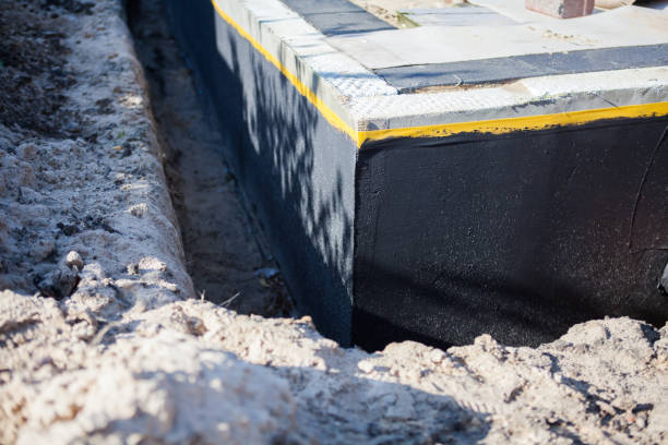 Professional Waterproofing technician working in Adelphi, MD